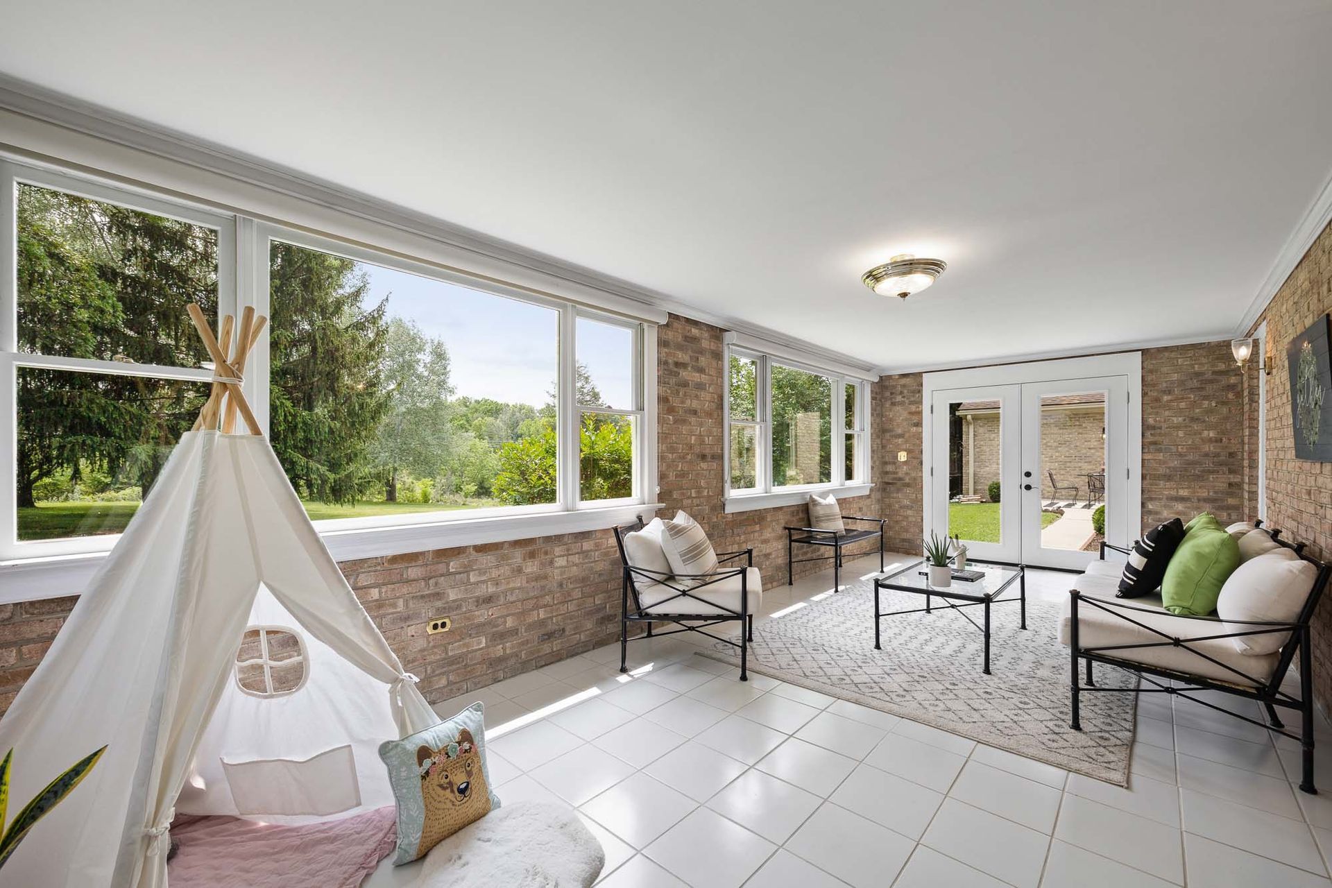 There is a teepee in the middle of the room.