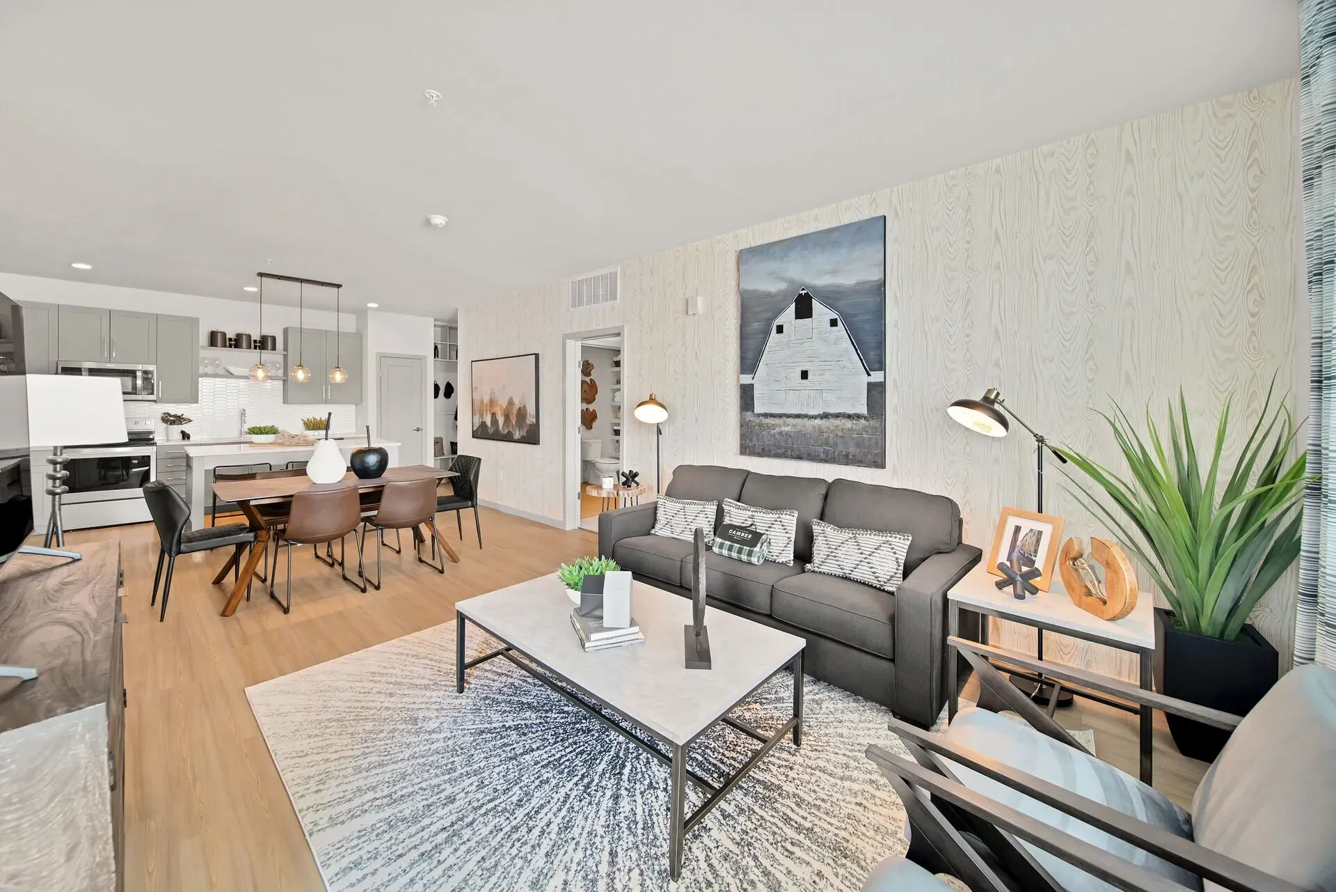 Modern living room and open kitchen with dining area.