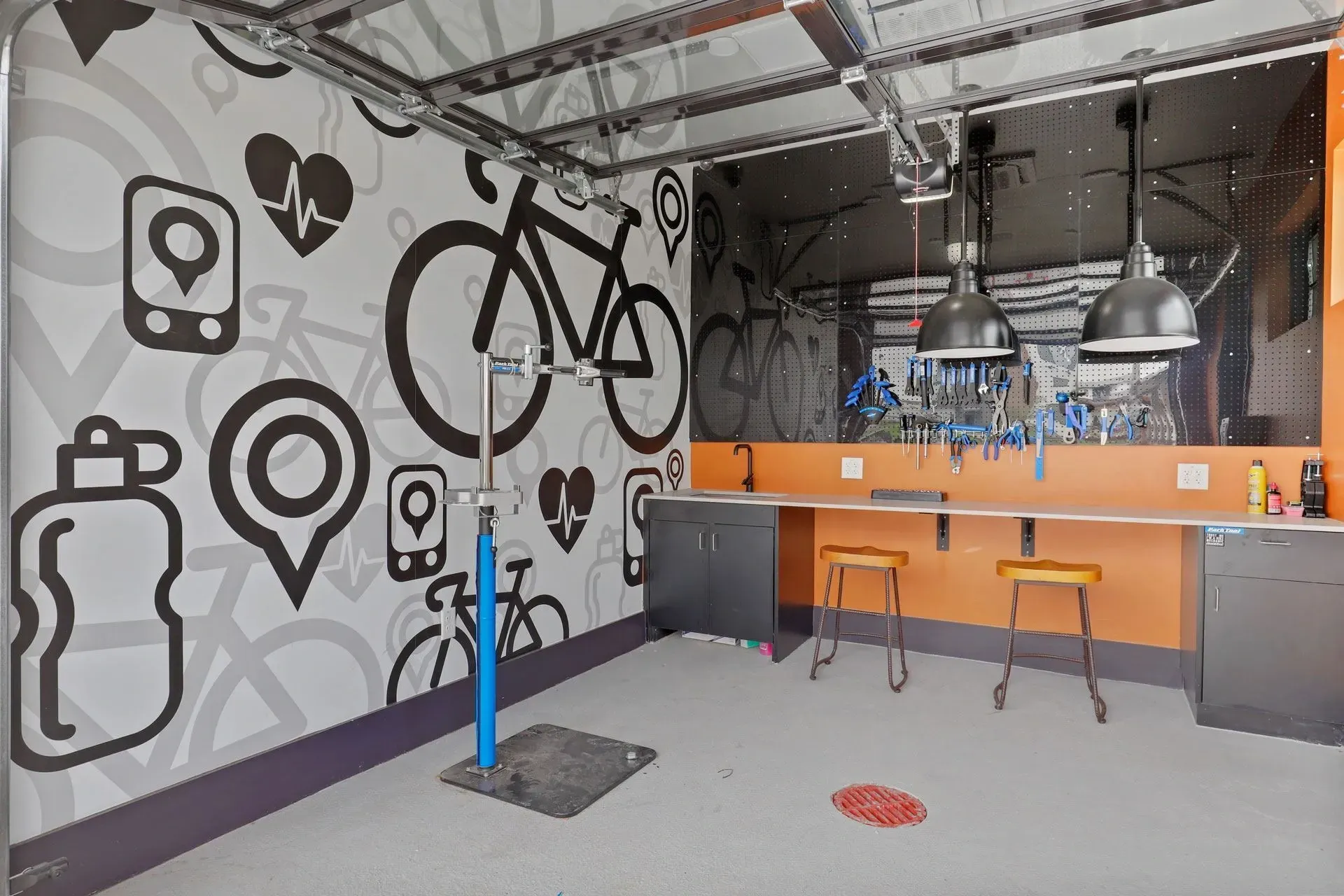 Bike repair station and workshop with tools and bike graphics.