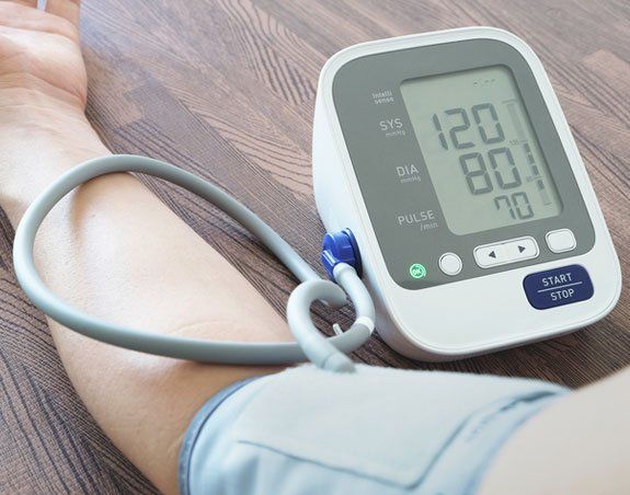 Man checking own blood pressure - Blood Pressure Checks in Camden North Haven, NSW