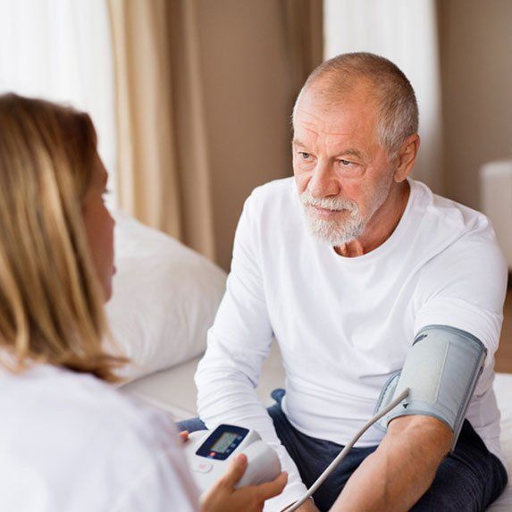 Elderly being tested for blood pressure - Blood Pressure Checks in Camden North Haven, NSW