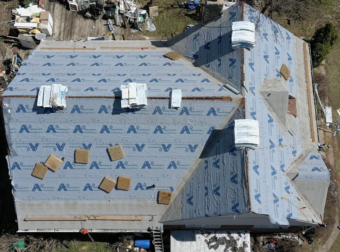 An aerial view of a roof that is being installed
