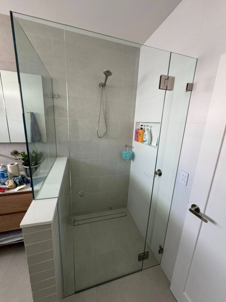 A bathroom with a walk in shower and a sink — Fast Glass & Glazing In Tamworth, NSW
