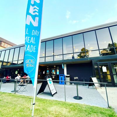 A large building with a blue banner that says all day meal trade