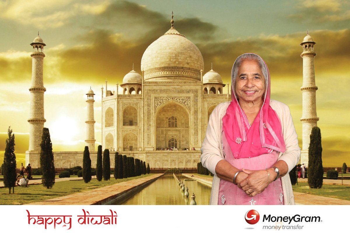 Green screen event photography of elderly Asian woman standing in front of the Taj Mahal