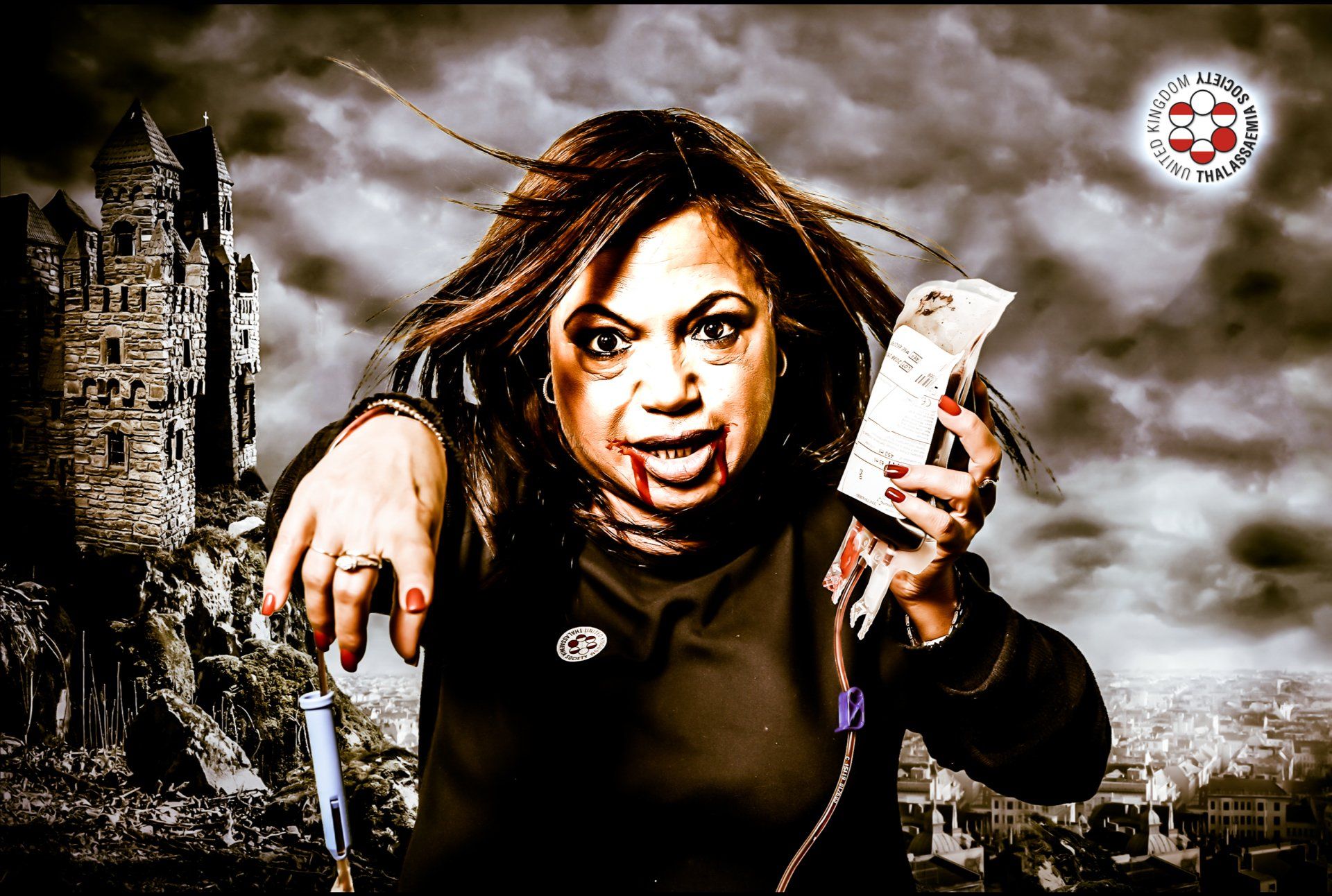 Portrait of Koula in front of a green screen backdrop at a photo shoot event with Ghelani Studios