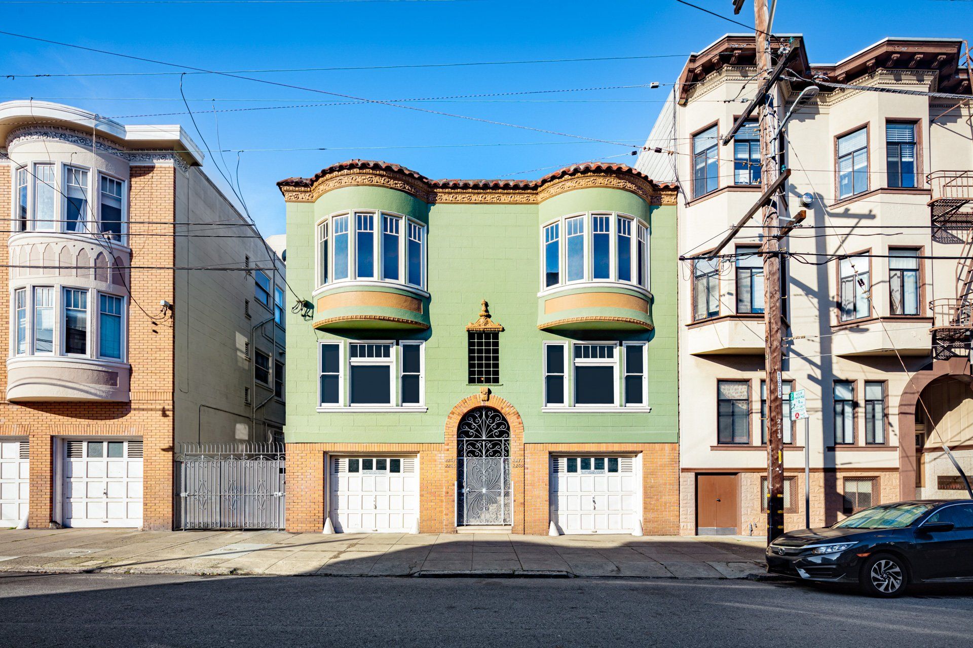 2205 Taylor St san francisco from street, a building with 2 garages & 4 windows.
