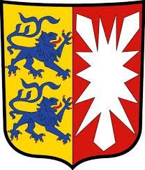 Ein Wappen mit zwei Löwen und einem Stern darauf.