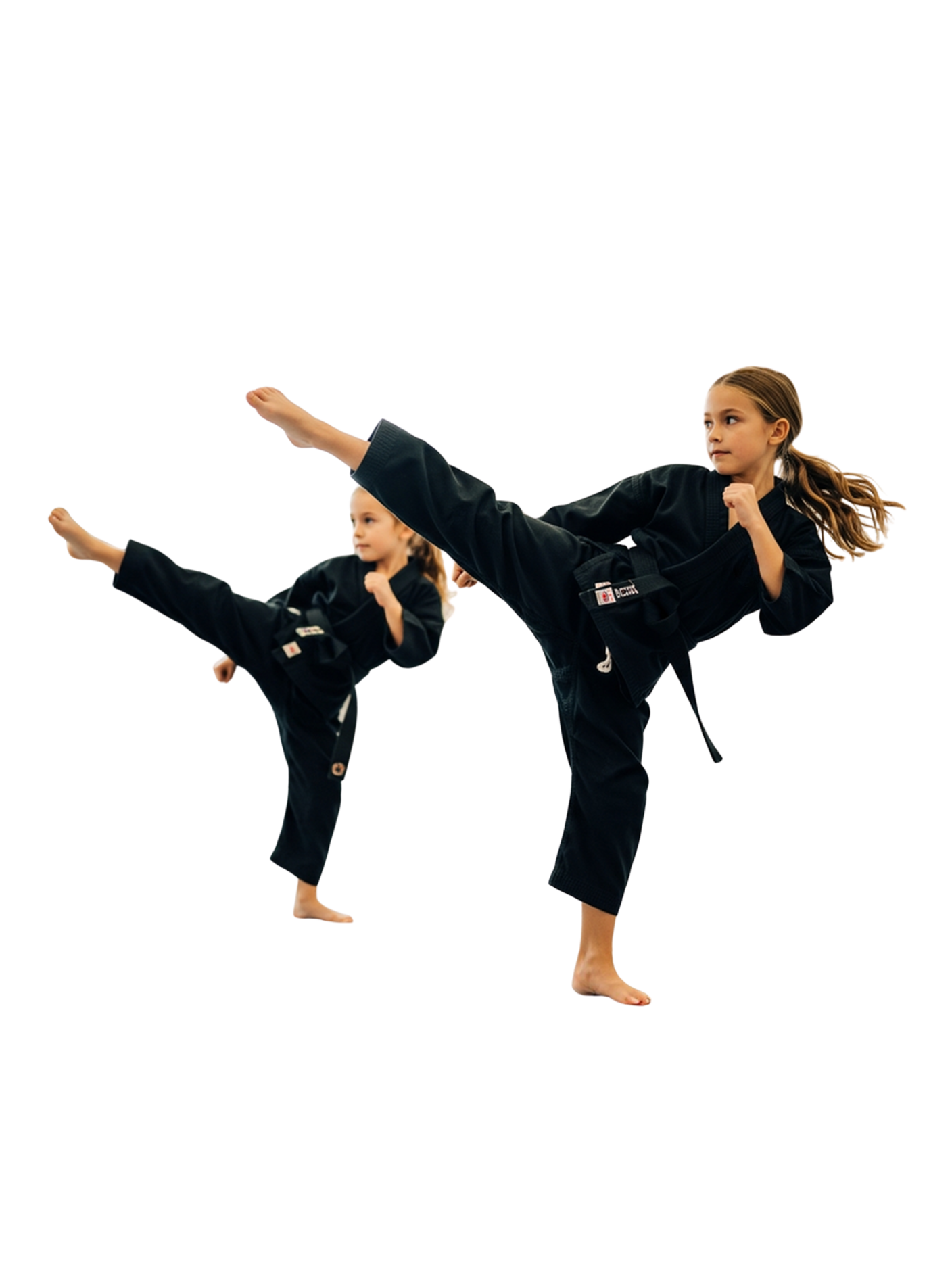 A boy and two girls are wearing karate uniforms and pointing at the camera