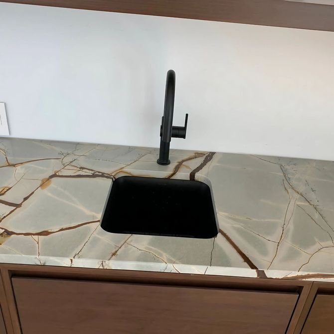 Blue Mountain Contractors LLC - A kitchen counter with a sink and a faucet