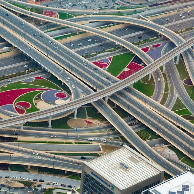 An aerial view of a busy intersection with lots of roads and bridges