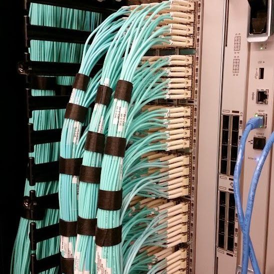 A bunch of wires are connected to a device that says ' ethernet ' on it