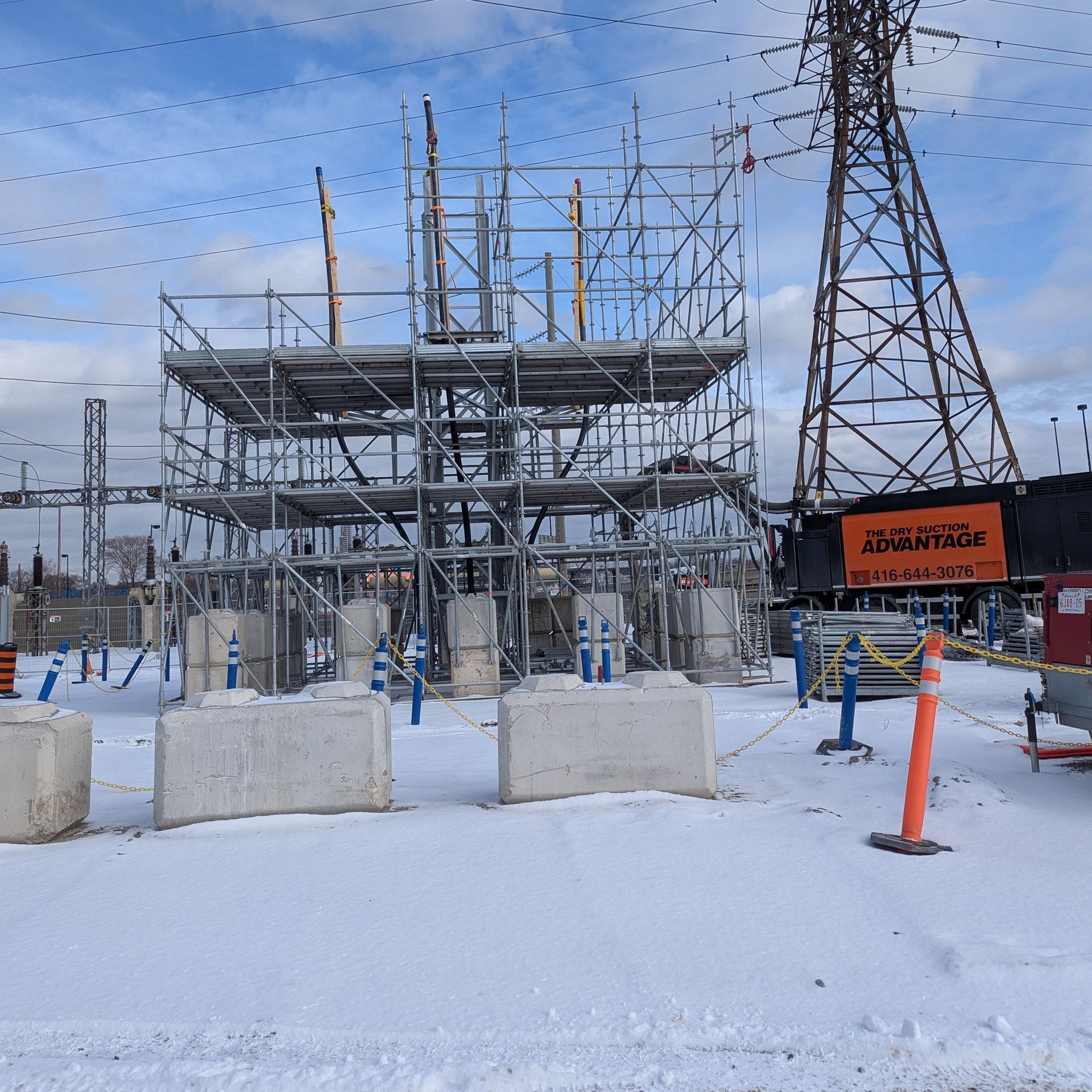 A construction site with scaffolding and a sign that says ' electrical ' on it