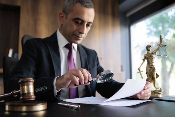 Legal advisor lawyer examining and signing legal documents.