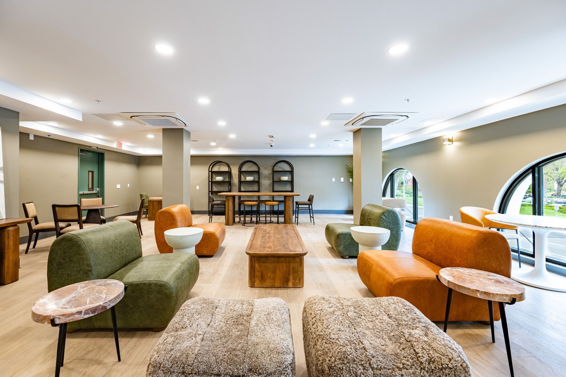 A living room filled with furniture and tables.