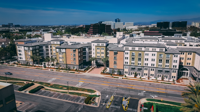 An aerial view of a large apartment complex in a city.