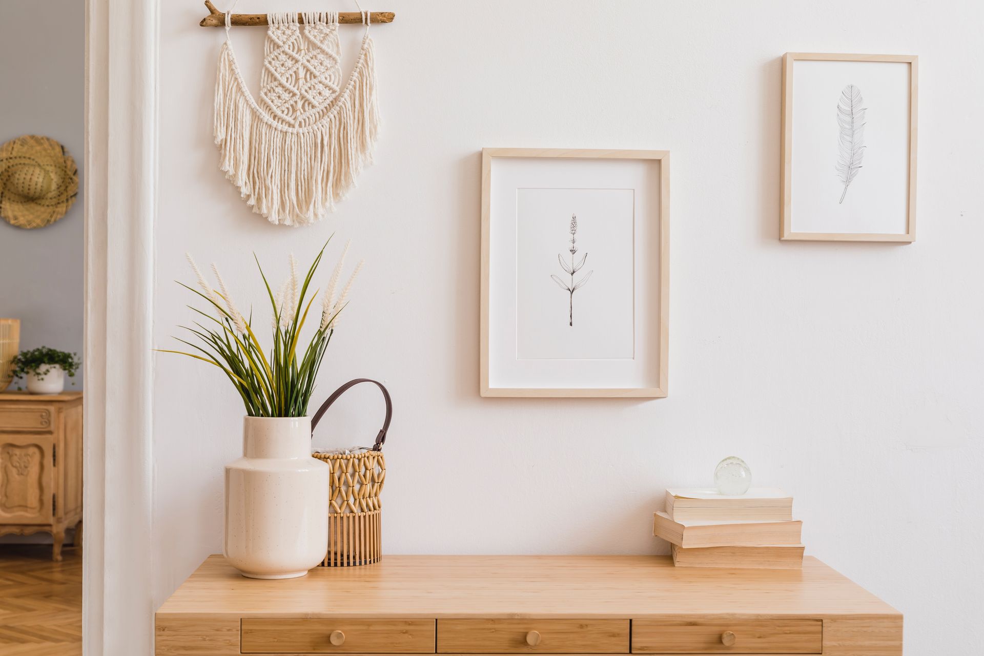 A wooden table with a plant in a vase on it.