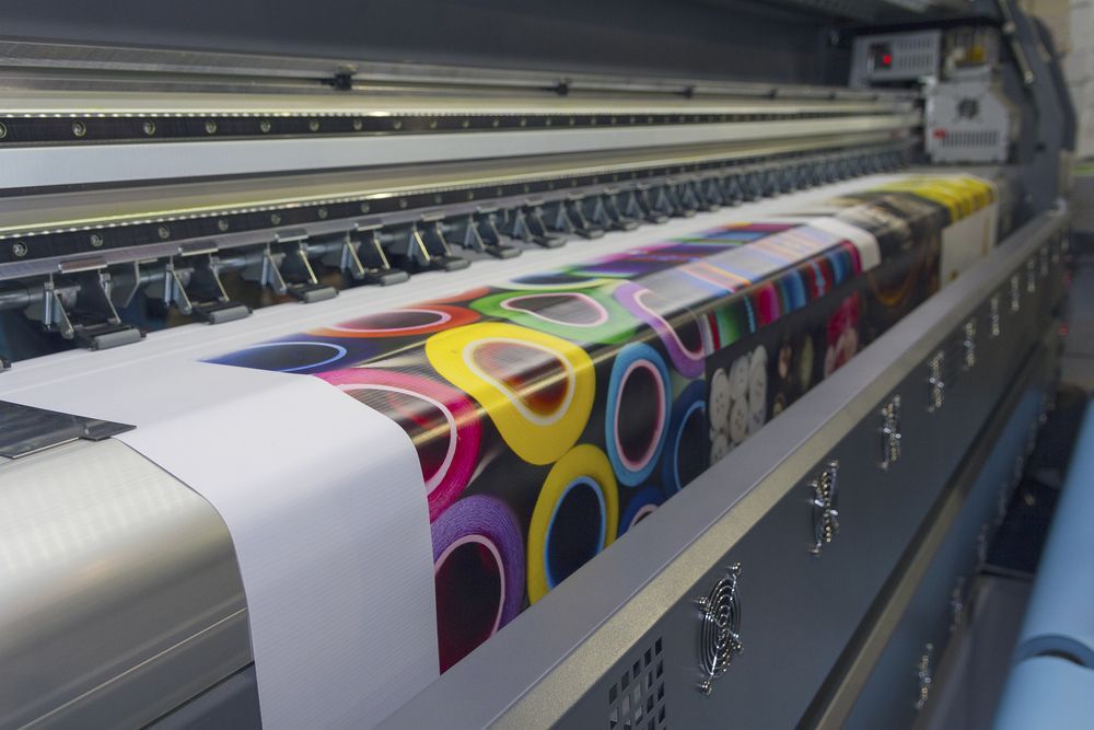 A Large Printer Is Printing A Tarpaulin  — JW Signs and Designs In Charters Towers, QLD