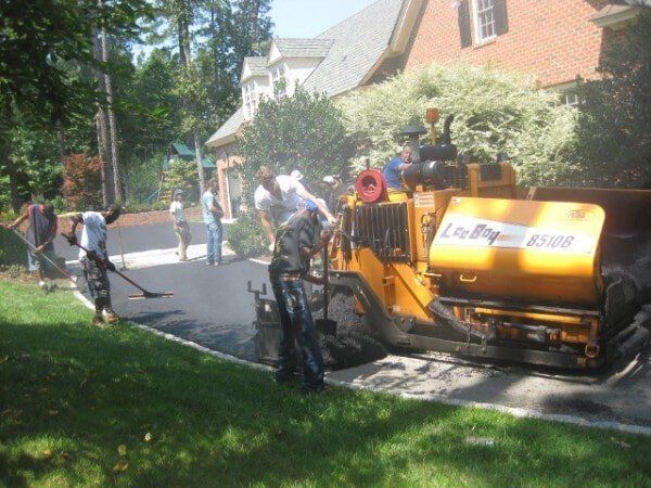 Laying Asphalt Pavement — Oilville, VA — Wells Paving & Seal Coating
