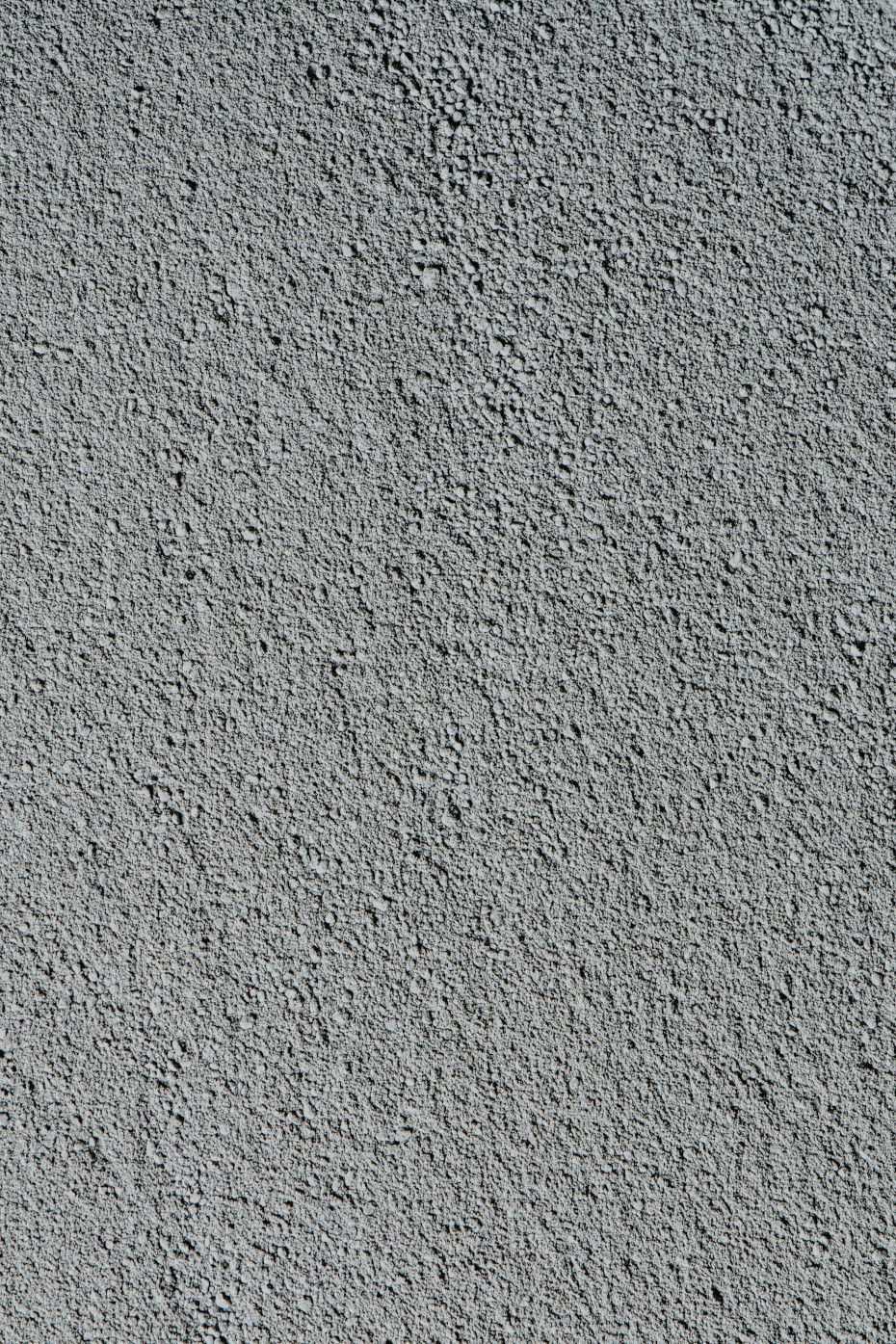 Close-up view of a gray, textured surface, possibly rubber or composite material.