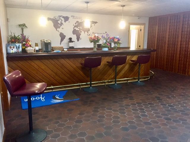 A bar with a map of the world on the wall