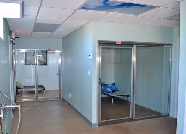 A hallway in a building with sliding glass doors