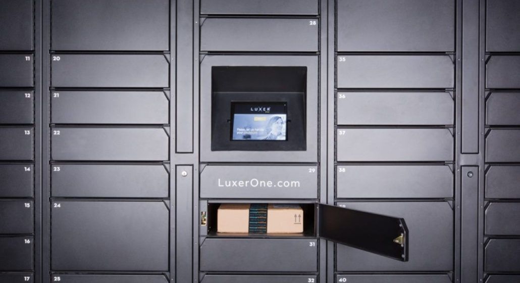 A box is sitting in a locker with the door open.