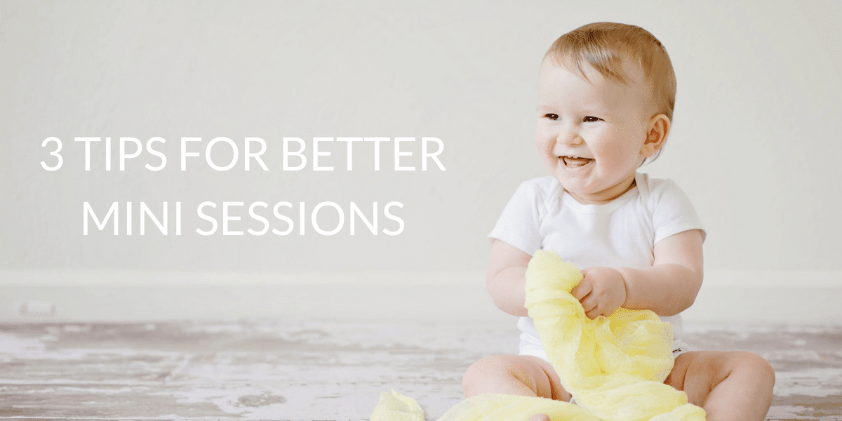 A baby is sitting on the floor holding a yellow blanket.