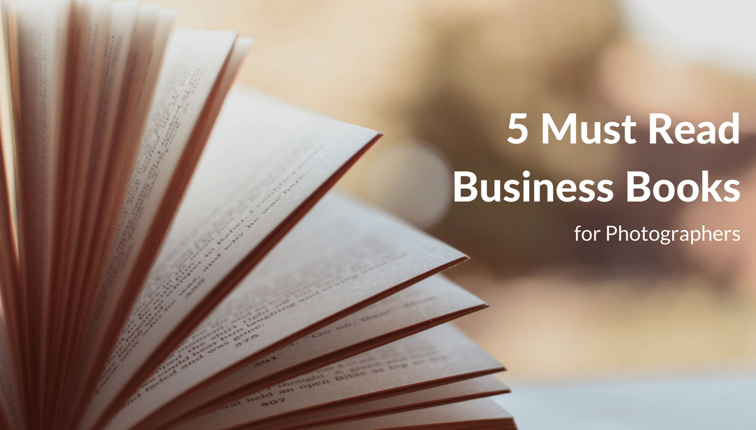 A book is open to a page that says 5 must read business books for photographers