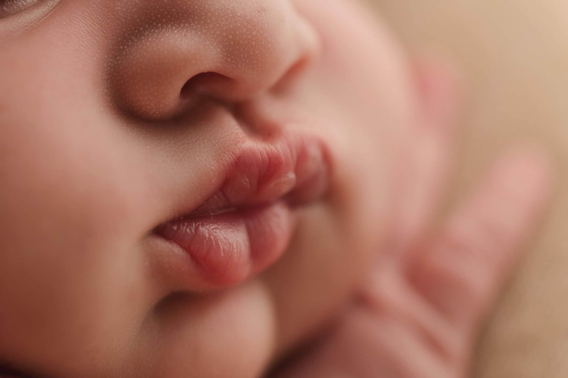 A close up of a baby 's mouth and nose.