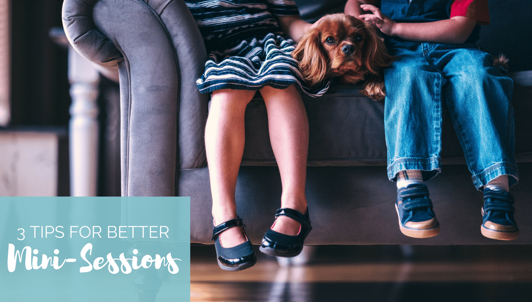 Two children and a dog are sitting on a couch.