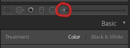 A black and white photo with a red circle around the basic button.