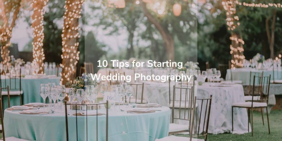 There are many tables and chairs set up for a wedding reception.