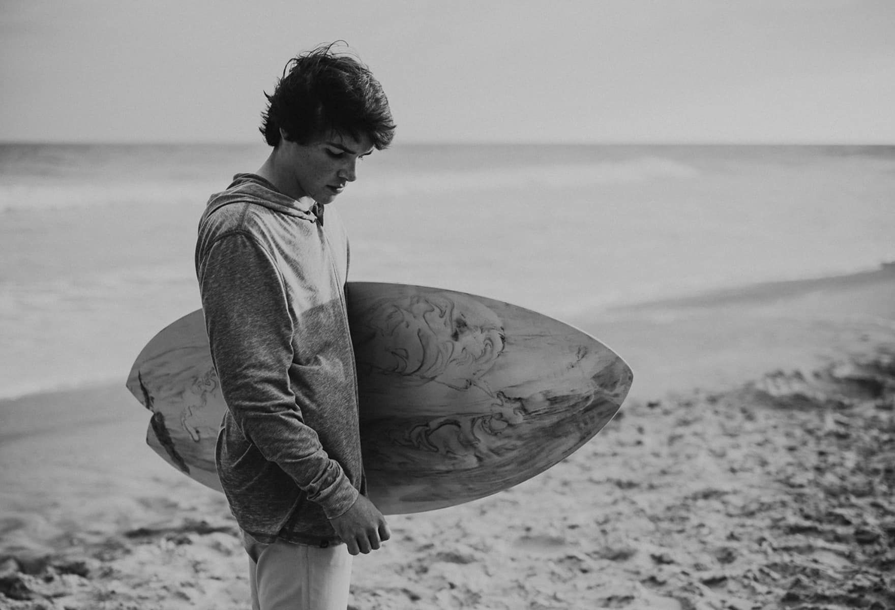 a young surfer on a beach