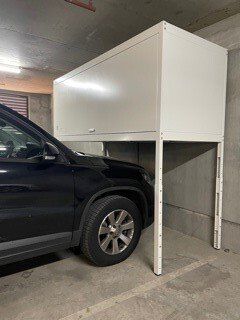 Over bonnet storage unit with a car parked underneath
