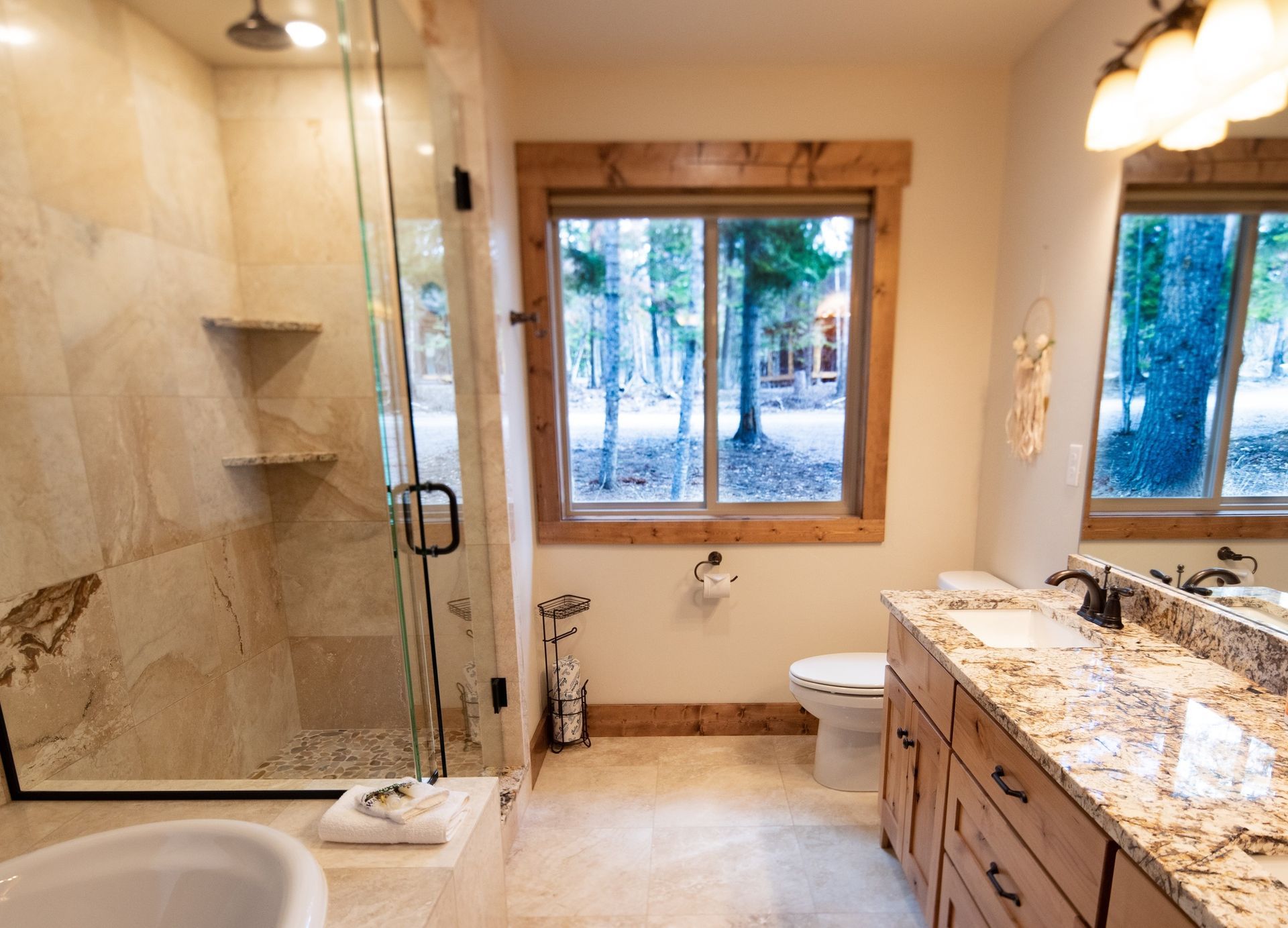 A bathroom with a tub , sink , toilet and shower.