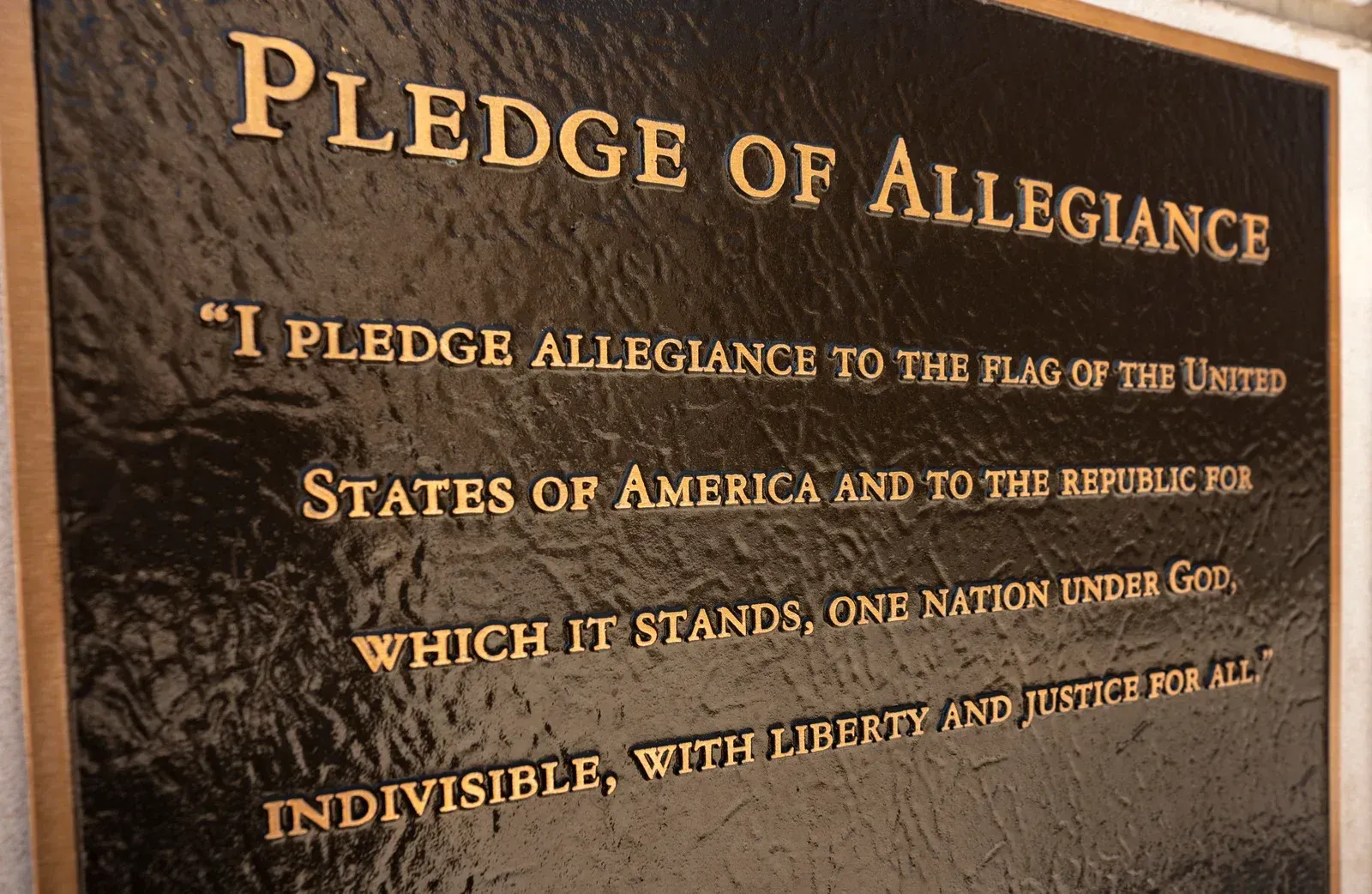 Variety of colorful lanyards with logos and text, including green, black, pink, and orange.