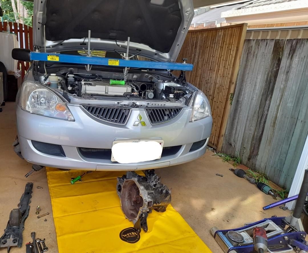 A Car Is Being Worked On In A Garage With The Hood Open — Weyba Automotive Services In Kuluin, QLD
