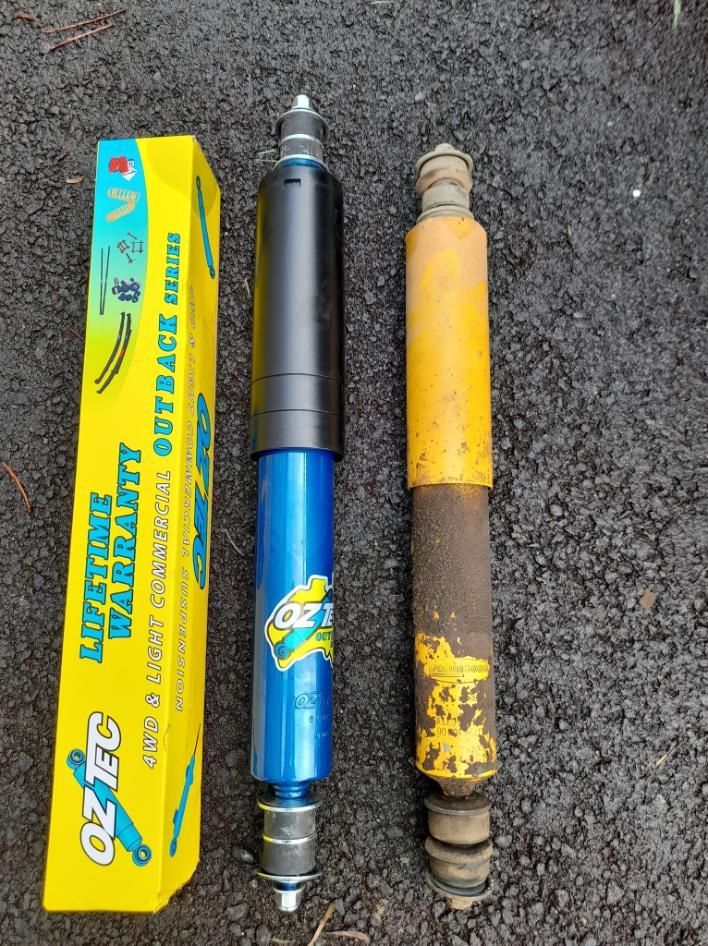 A Blue Shock Absorber Next To A Yellow Box That Says Lifetime Warranty — Weyba Automotive Services In Maroochydore, QLD