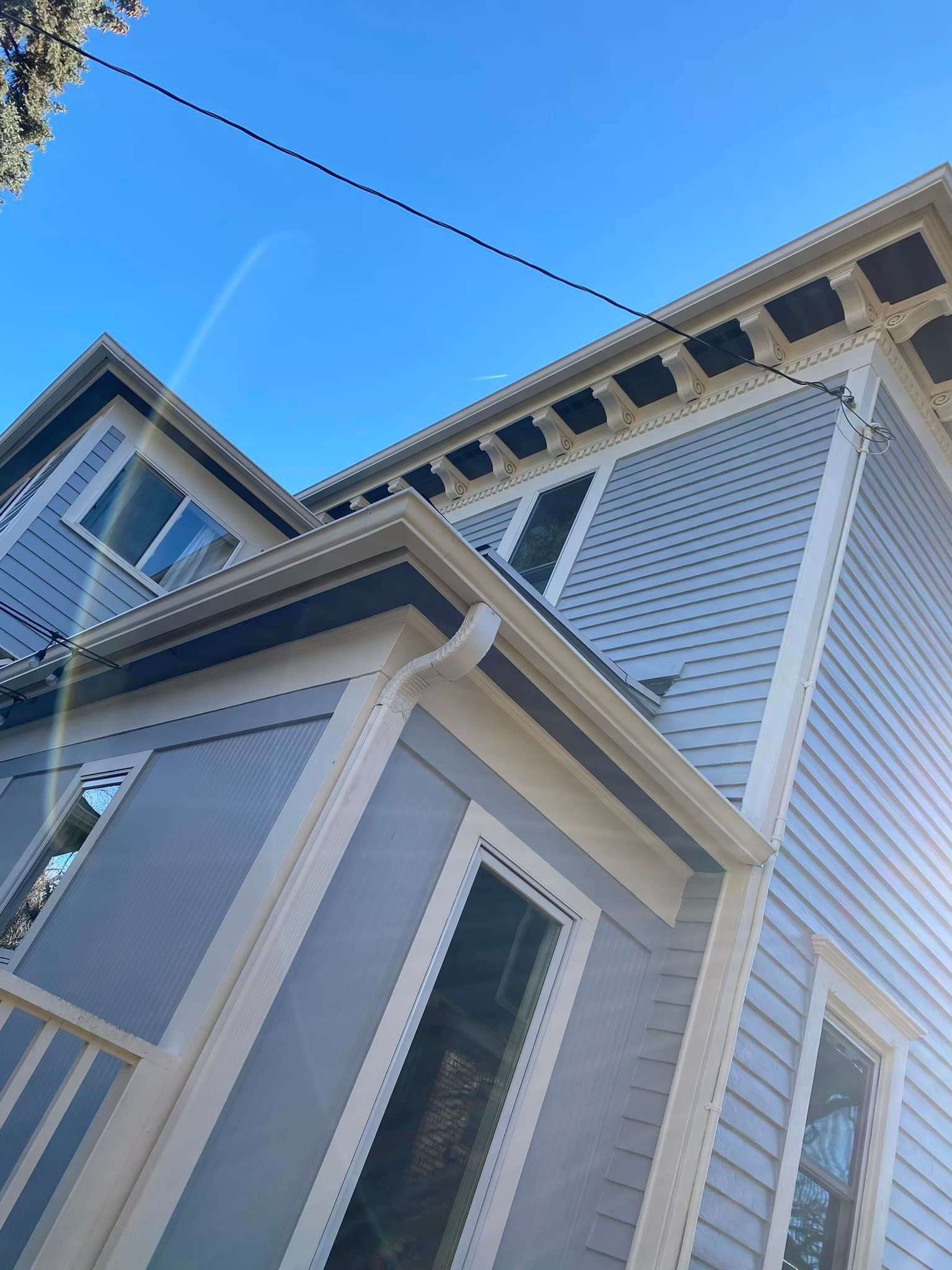 Looking up at a house with a blue sky in the background