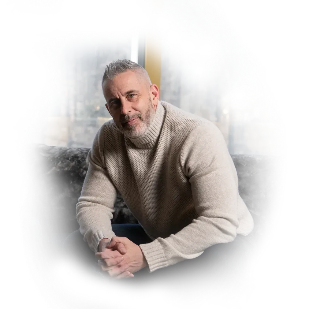 A black and white drawing of a shark with green eyes