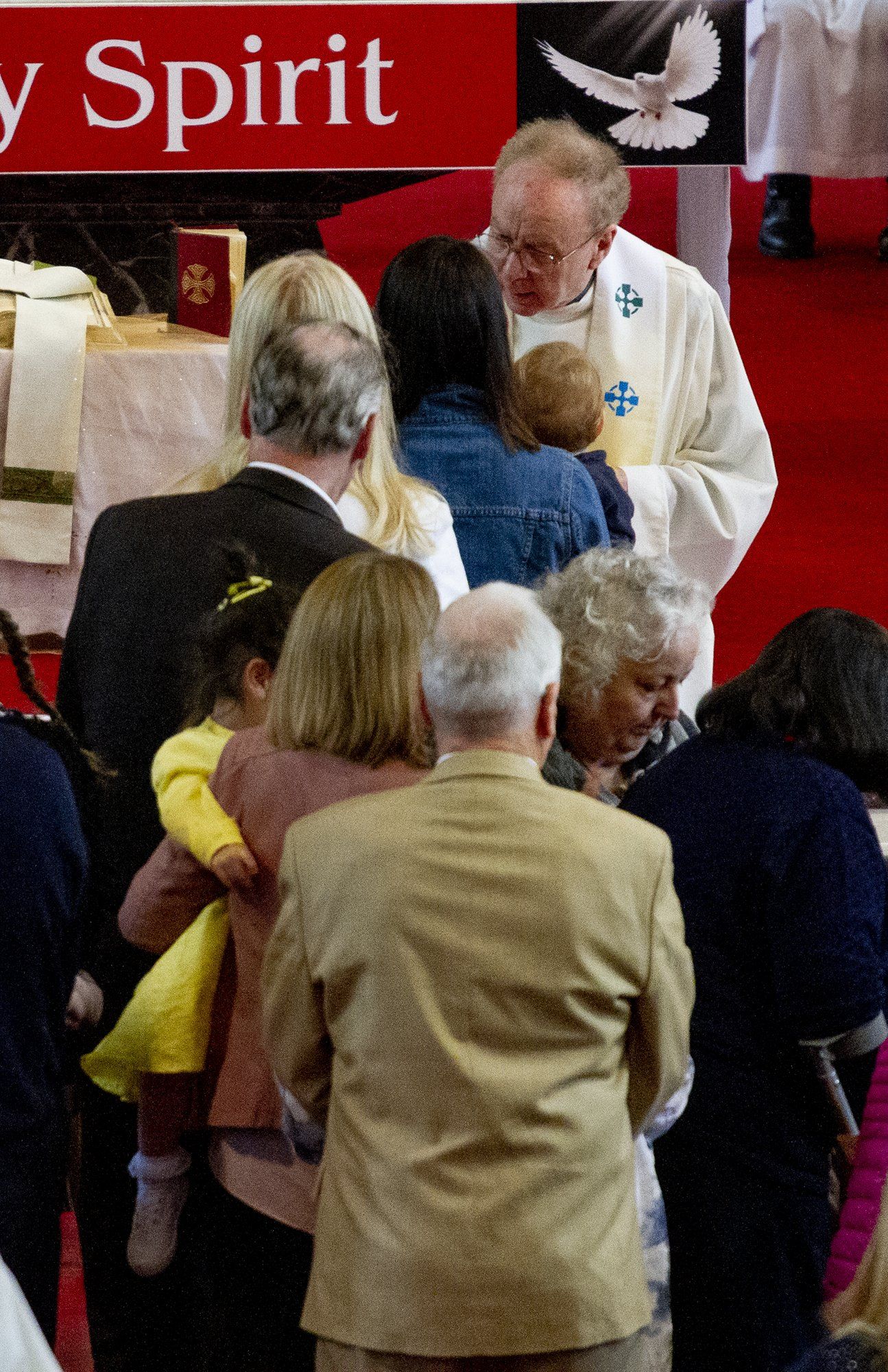 A group of people standing in front of a sign that says spirit