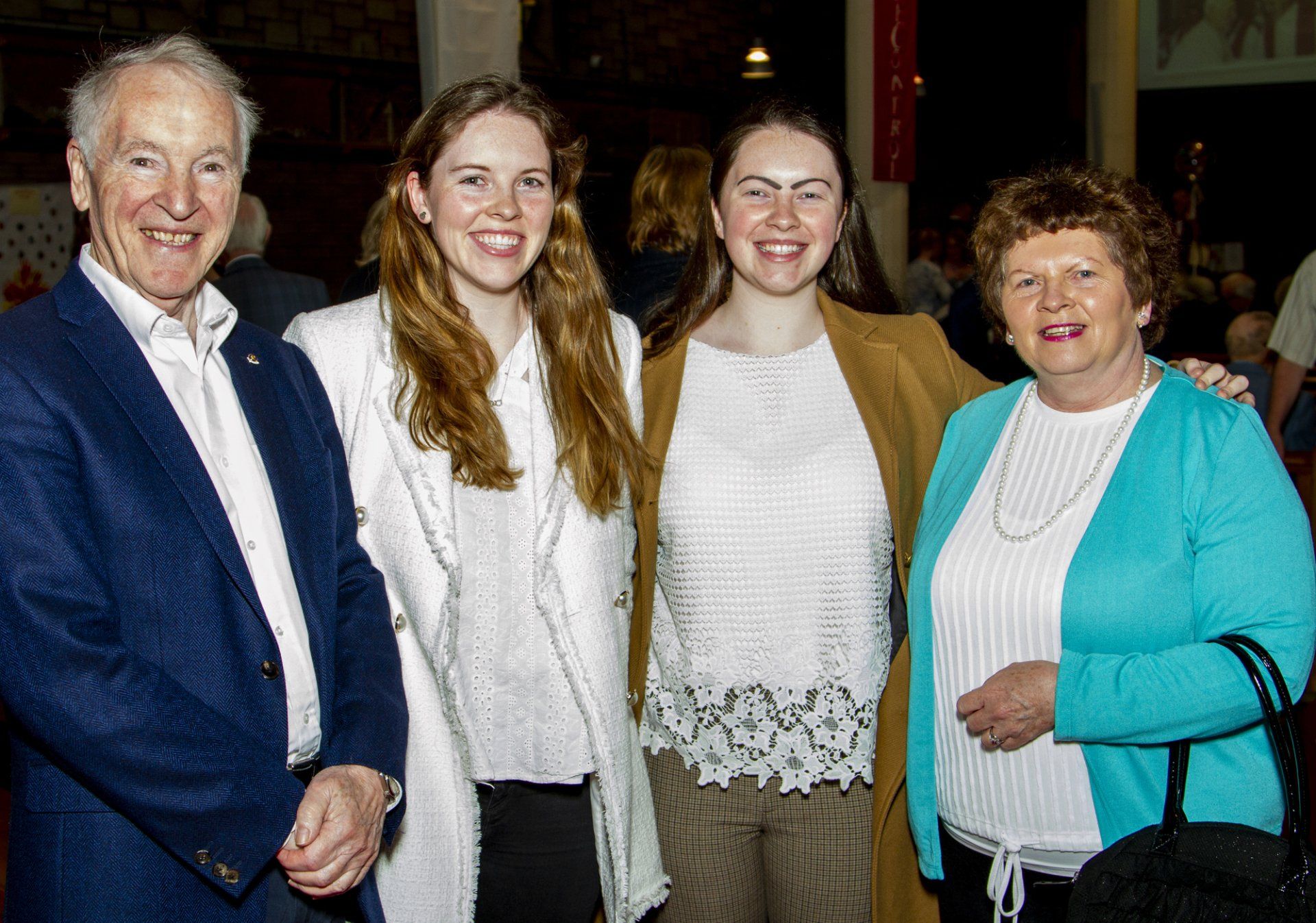 A group of people are posing for a picture together.