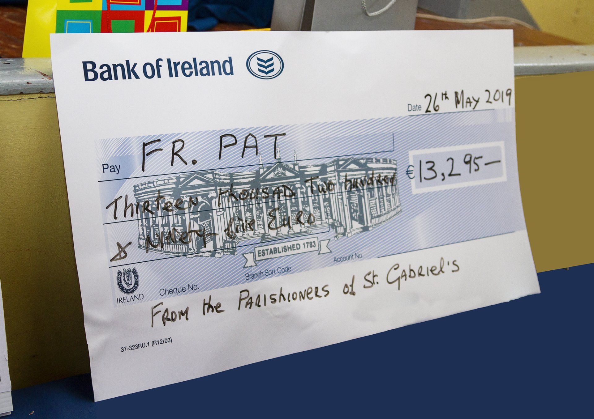 A check from the bank of ireland is on a table