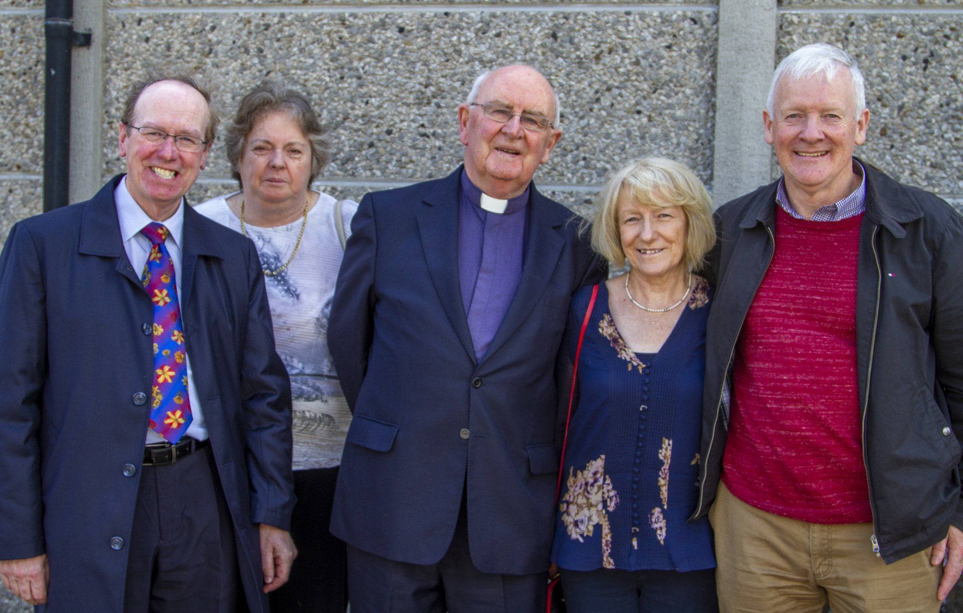 A group of people are posing for a picture together.