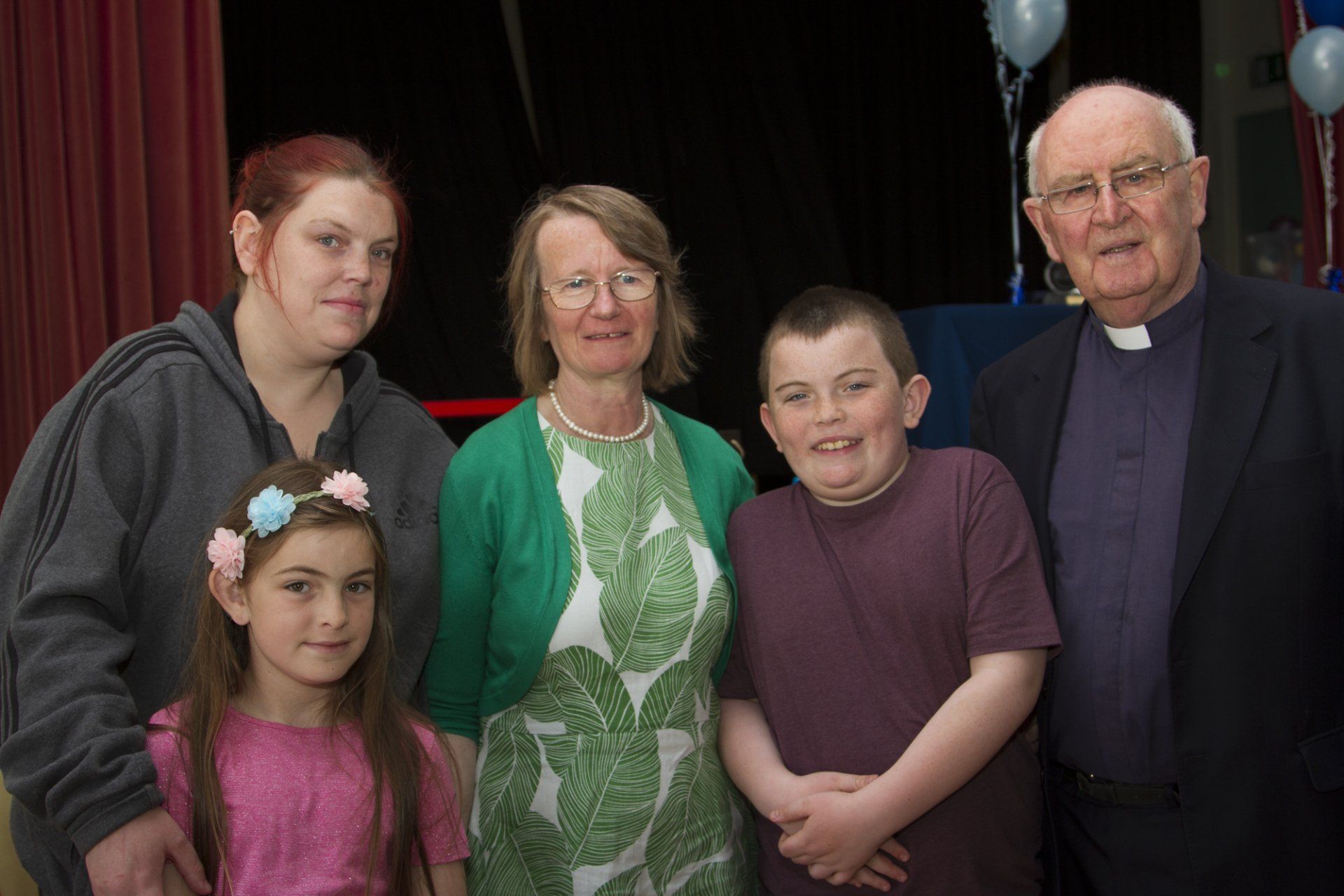 A group of people are posing for a picture together.