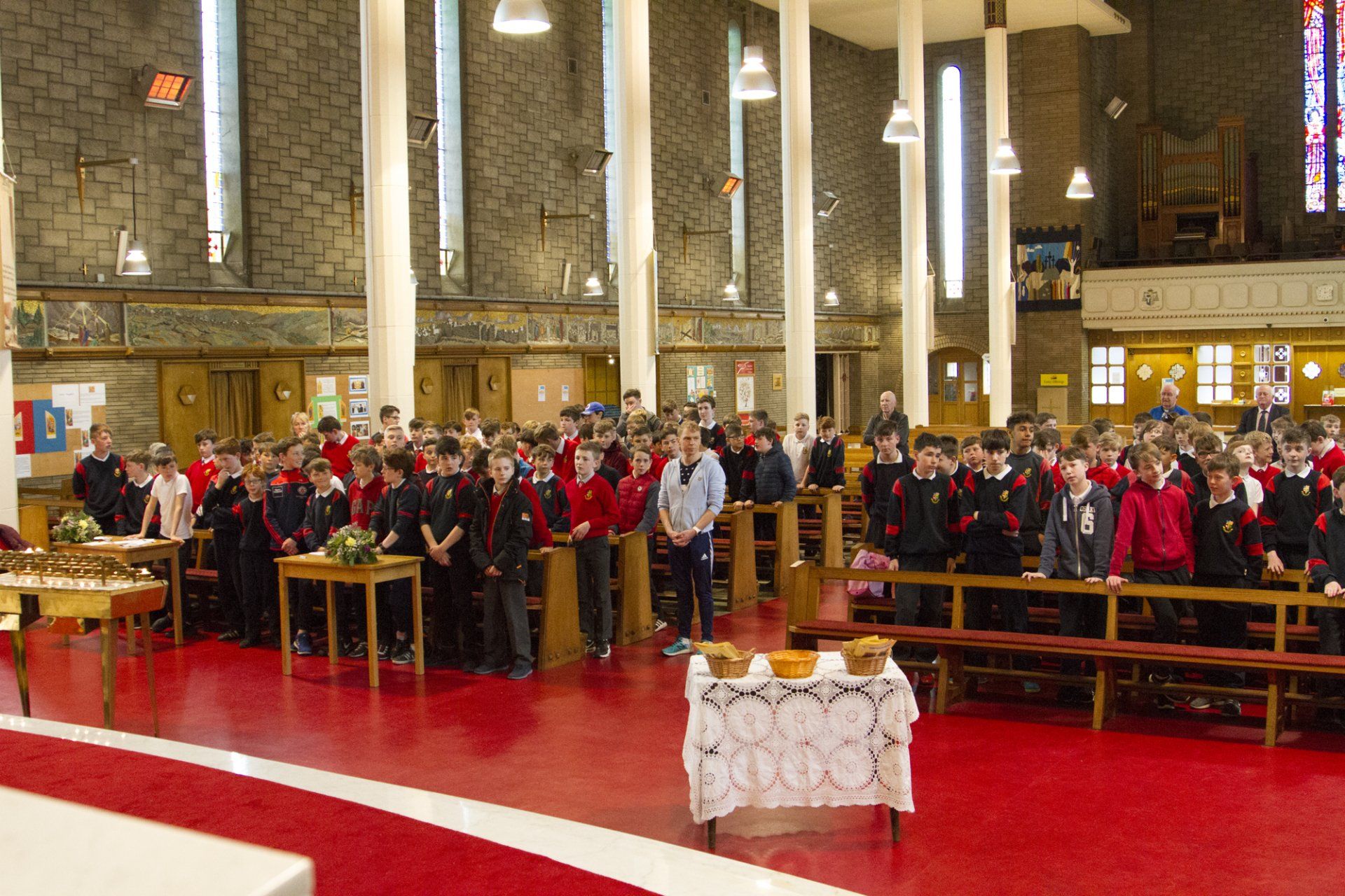 A large group of people are standing in a church