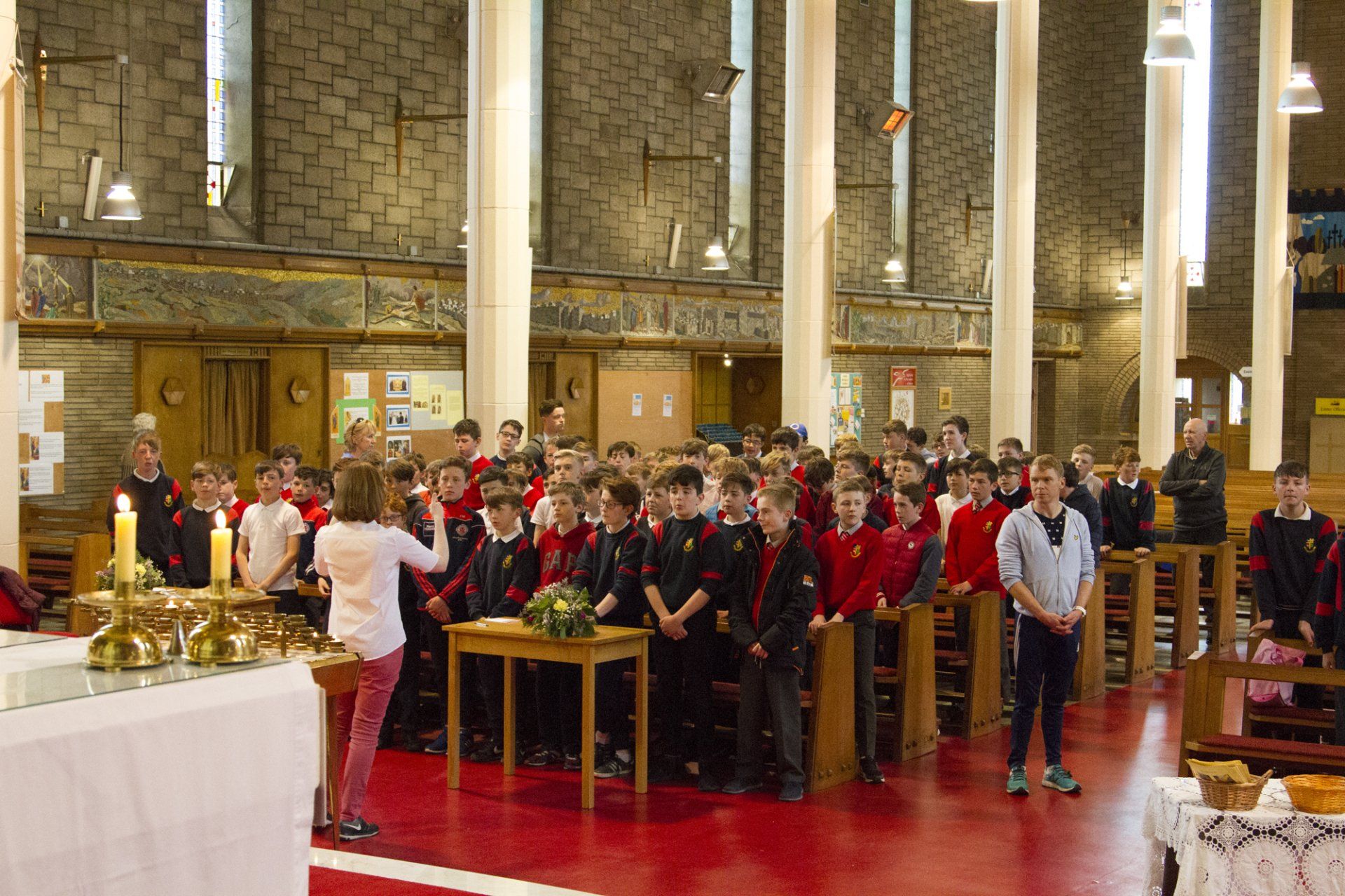 A group of children are standing in a church.