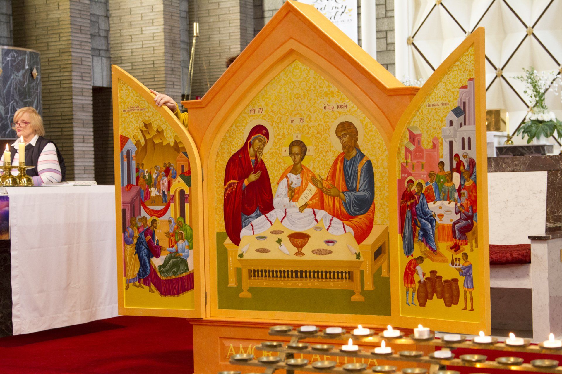 A church with candles and an icon on the altar