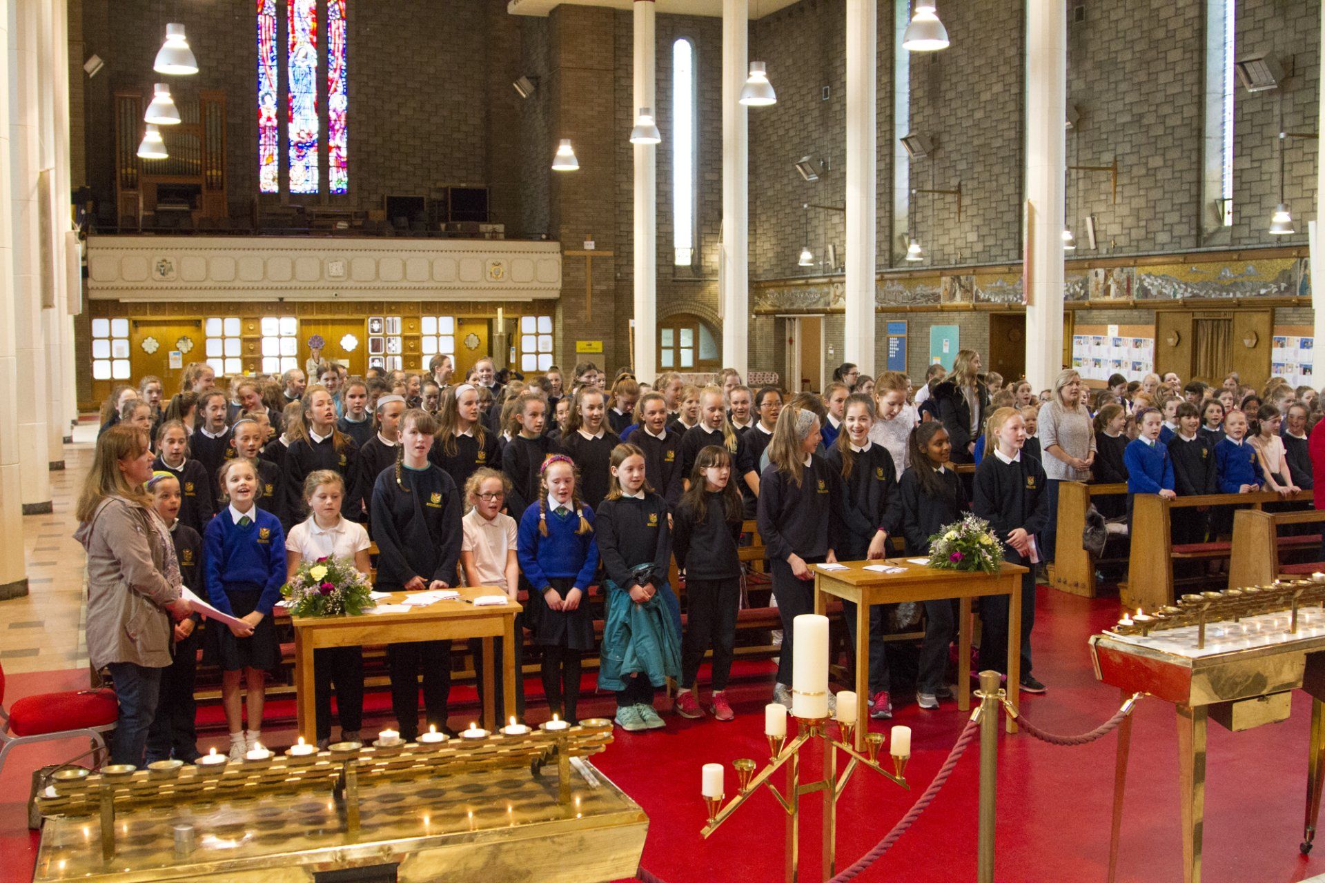 A large group of people are sitting in a church